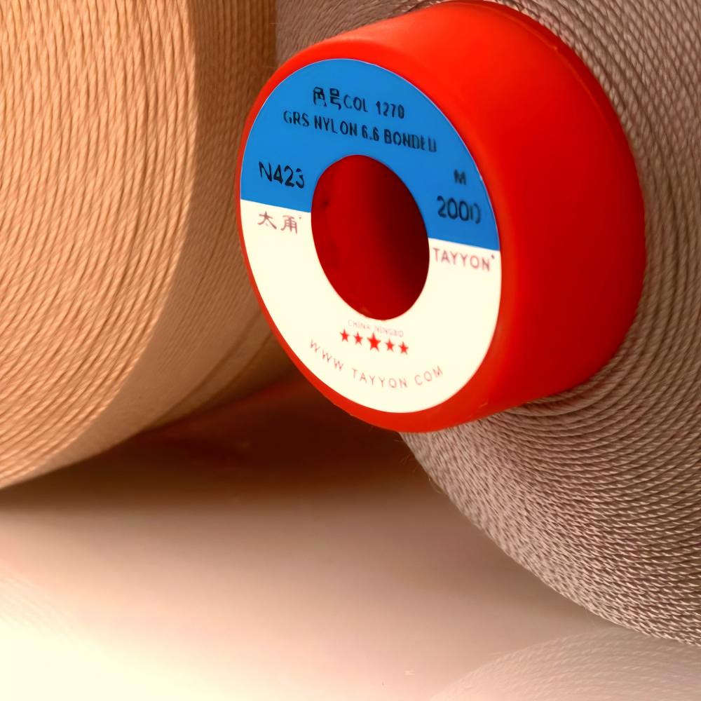 Filament bonded nylon 6.6 sewing thread